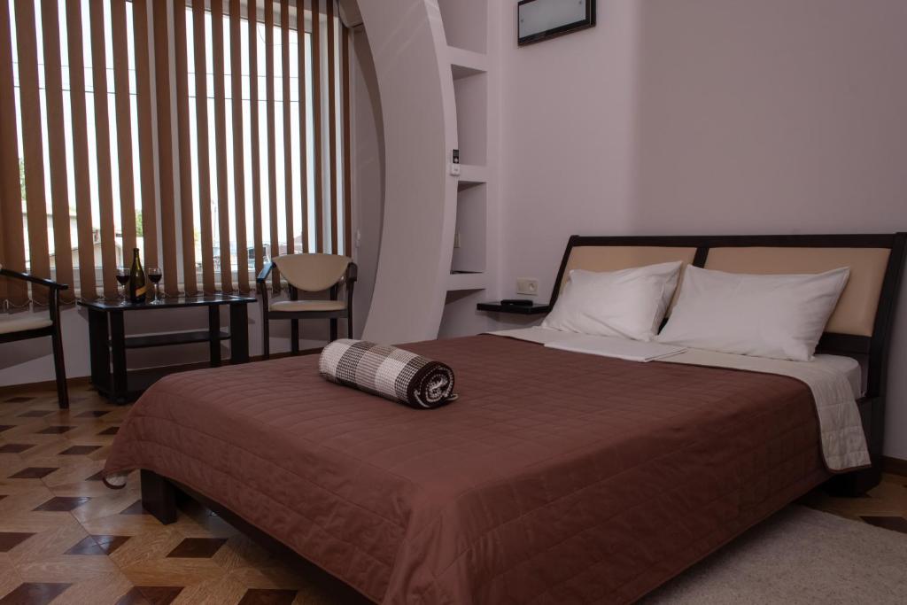 Postel nebo postele na pokoji v ubytování Гостевой дом Лазурный