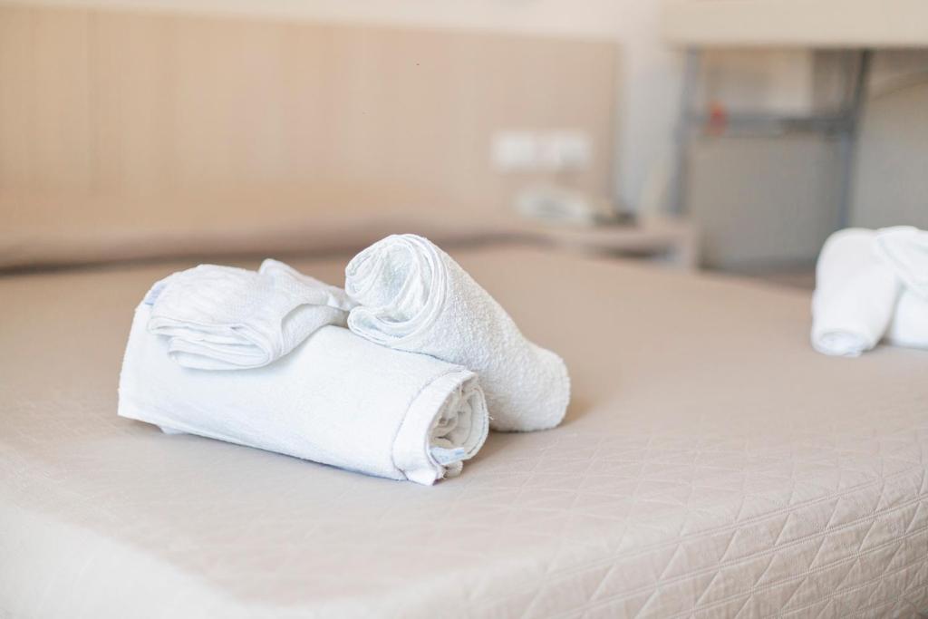 Postel nebo postele na pokoji v ubytování Hotel Primiana