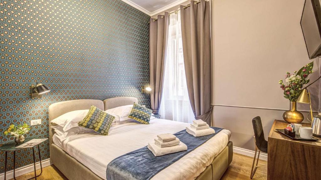 Postel nebo postele na pokoji v ubytování Charme Spagna Boutique Hotel