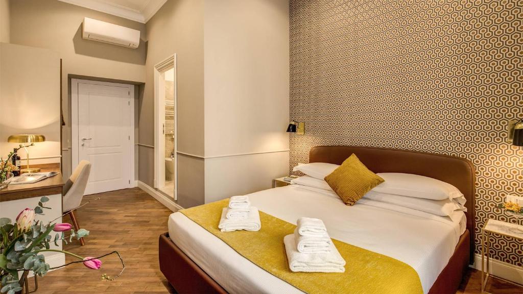 Postel nebo postele na pokoji v ubytování Charme Spagna Boutique Hotel