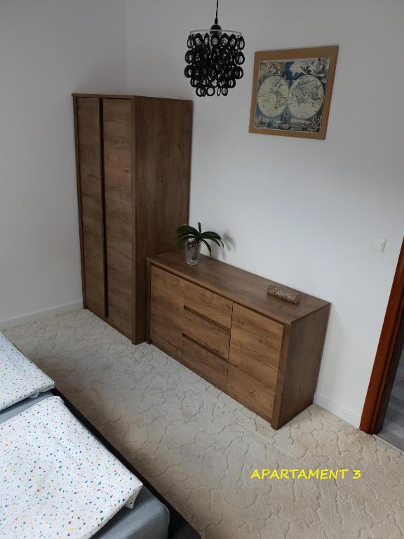 Łóżko lub łóżka w pokoju w obiekcie Apartamenty Amalia
