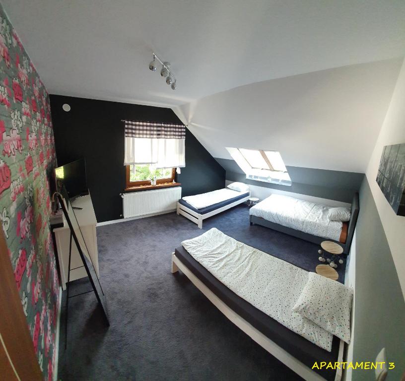 Łóżko lub łóżka w pokoju w obiekcie Apartamenty Amalia