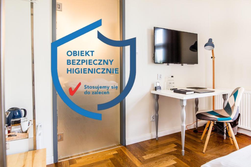 Televízia a/alebo spoločenská miestnosť v ubytovaní NOVUMHOUSE - Tomasza