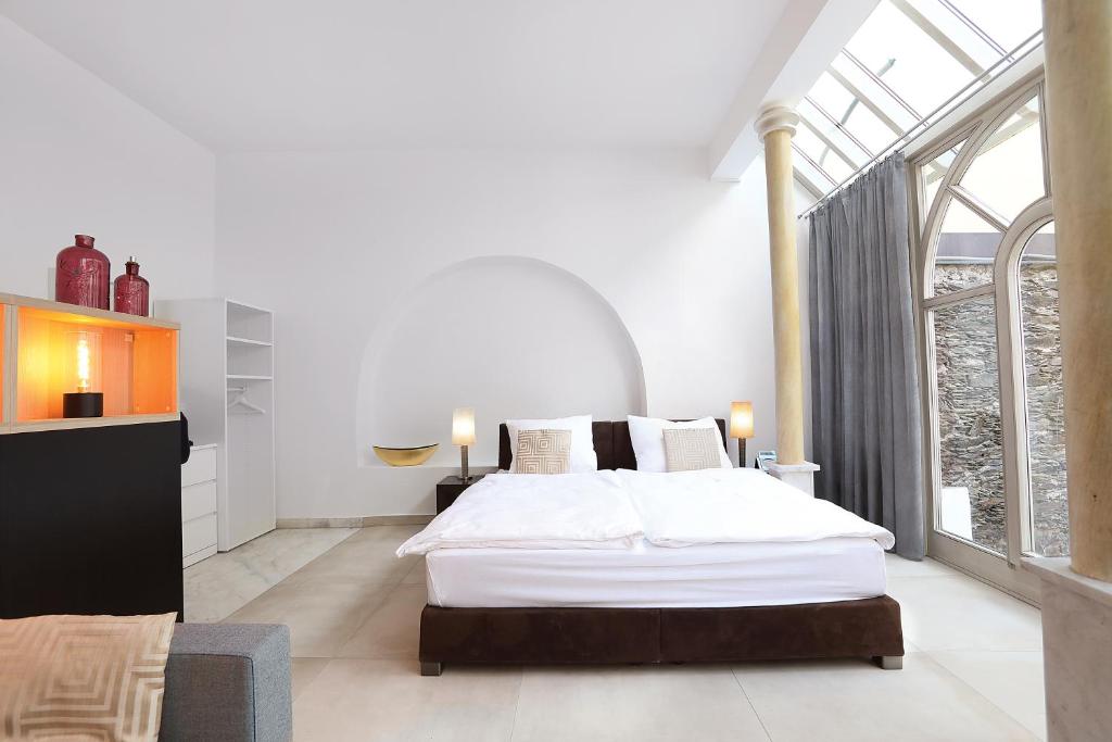 Postel nebo postele na pokoji v ubytování Stylische Cityapartments Benedikt
