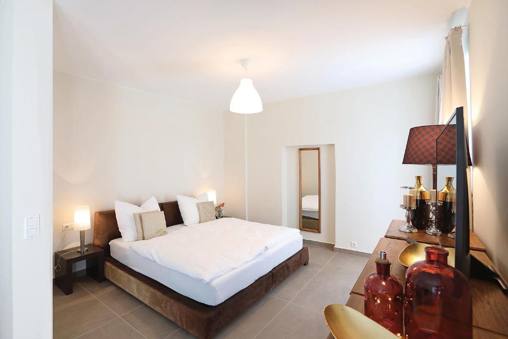 Postel nebo postele na pokoji v ubytování Stylische Cityapartments Benedikt