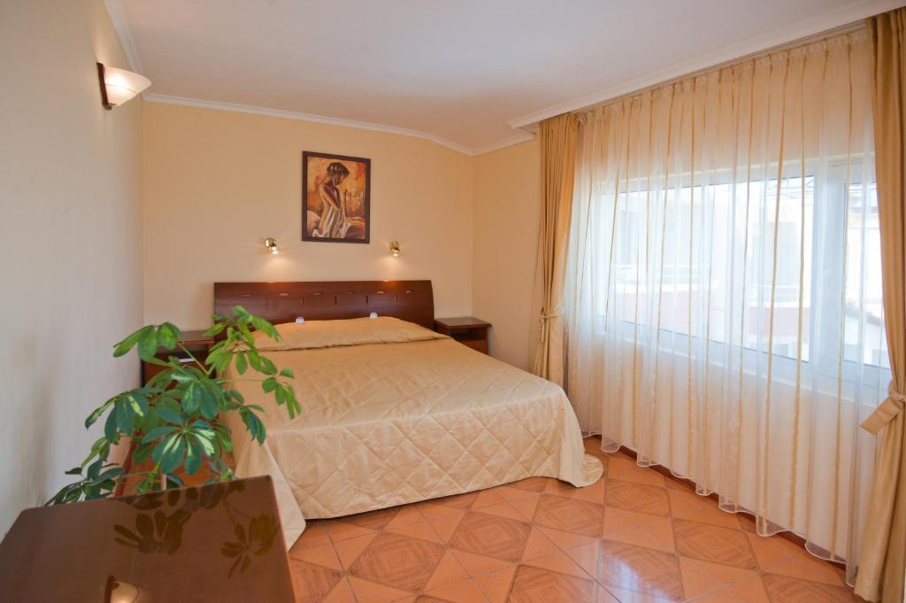 Postel nebo postele na pokoji v ubytování Hotel Villa List