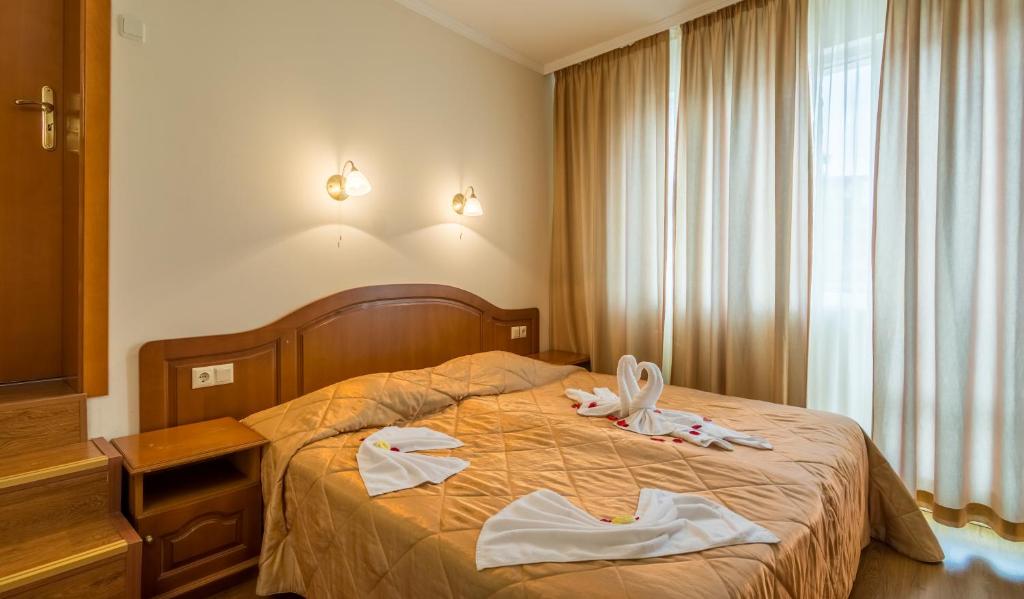 Postel nebo postele na pokoji v ubytování Hotel Villa List