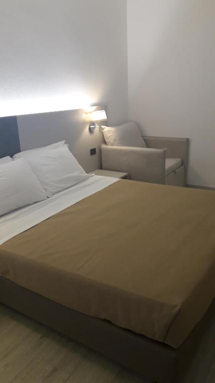 Postel nebo postele na pokoji v ubytování Hotel Cinzia