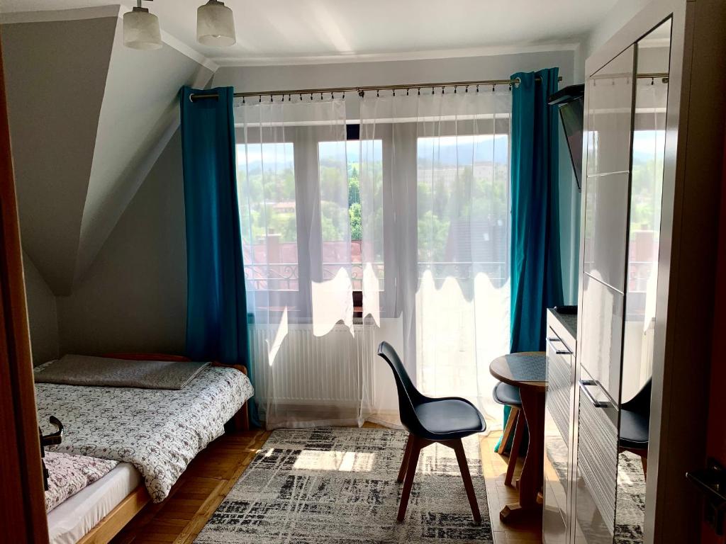 Posteľ alebo postele v izbe v ubytovaní Willa Widokowa Zakopane