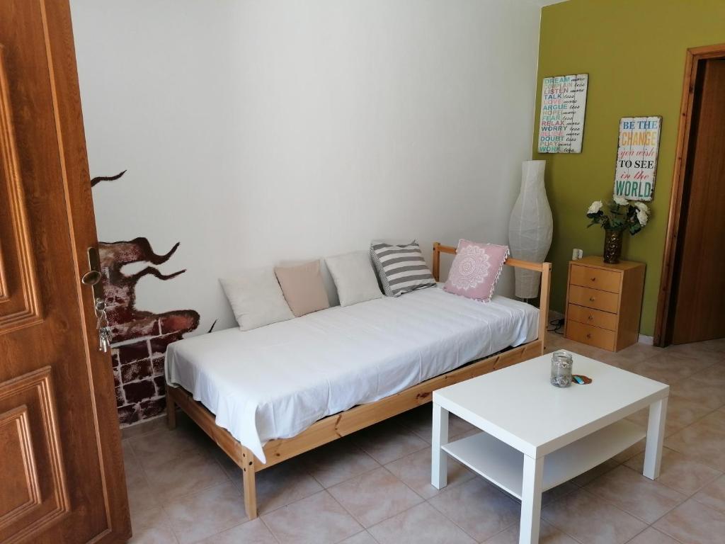 Posteľ alebo postele v izbe v ubytovaní Olive green house