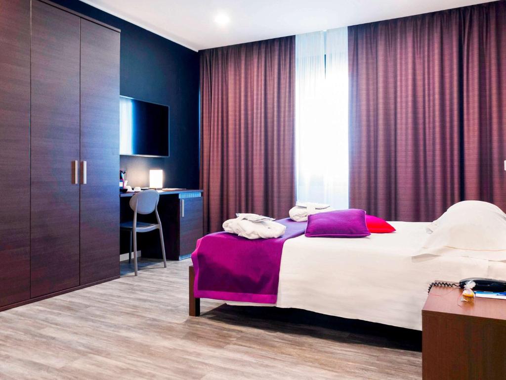 Postel nebo postele na pokoji v ubytování Mercure Palermo Centro