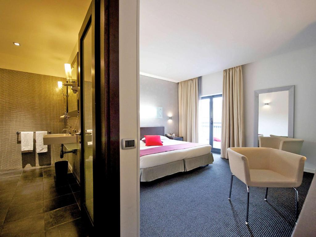 Postel nebo postele na pokoji v ubytování Mercure Palermo Centro