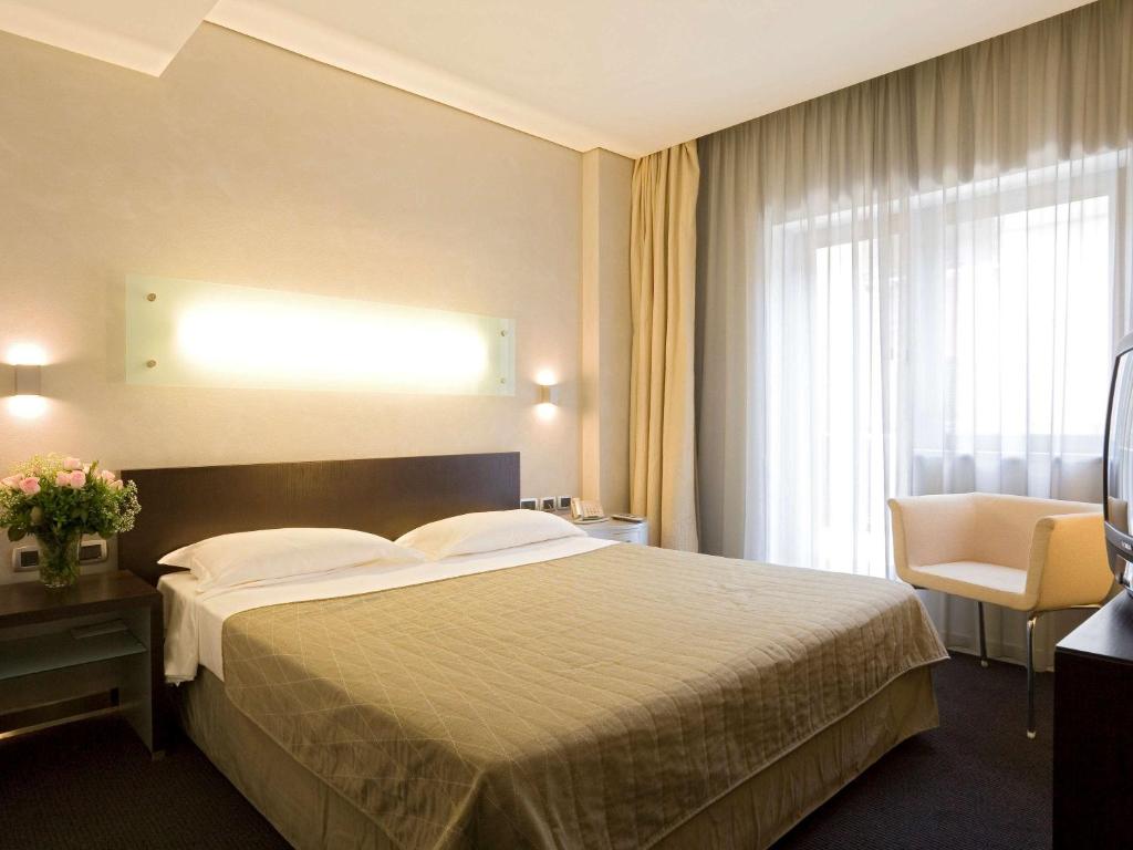 Postel nebo postele na pokoji v ubytování Mercure Palermo Centro