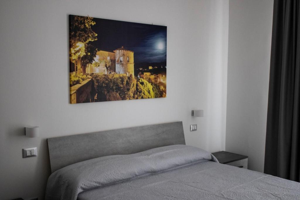 Letto o letti in una camera di InCentroScalea B&B