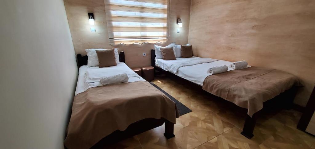 Postel nebo postele na pokoji v ubytování Cuki Residence