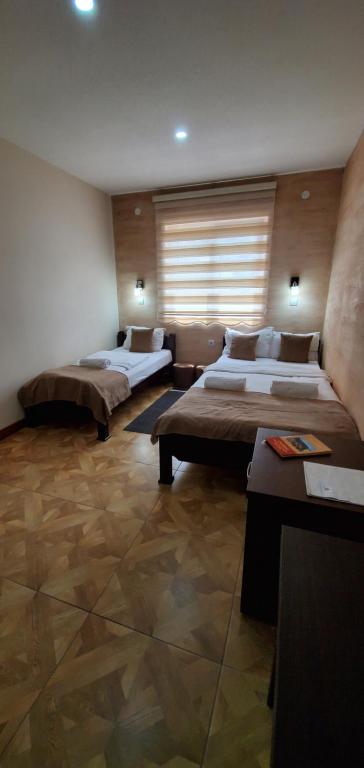 Postel nebo postele na pokoji v ubytování Cuki Residence