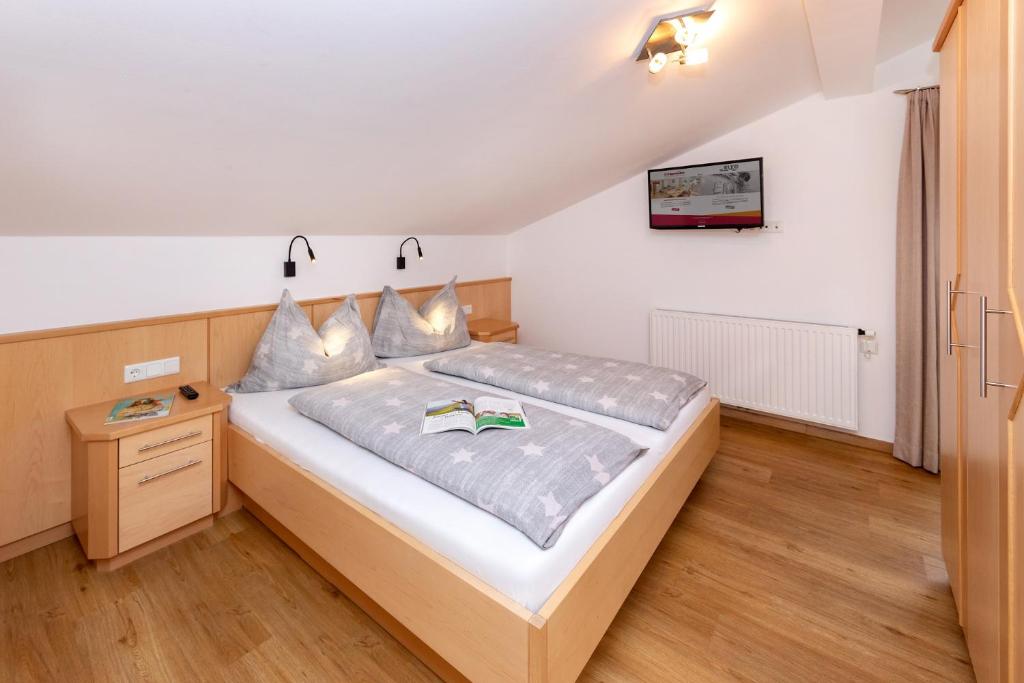 Ένα ή περισσότερα κρεβάτια σε δωμάτιο στο Elto Appartements Chalet