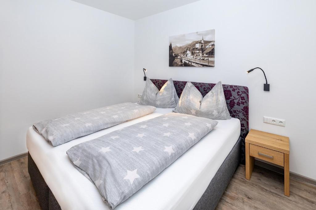 Ένα ή περισσότερα κρεβάτια σε δωμάτιο στο Elto Appartements Chalet