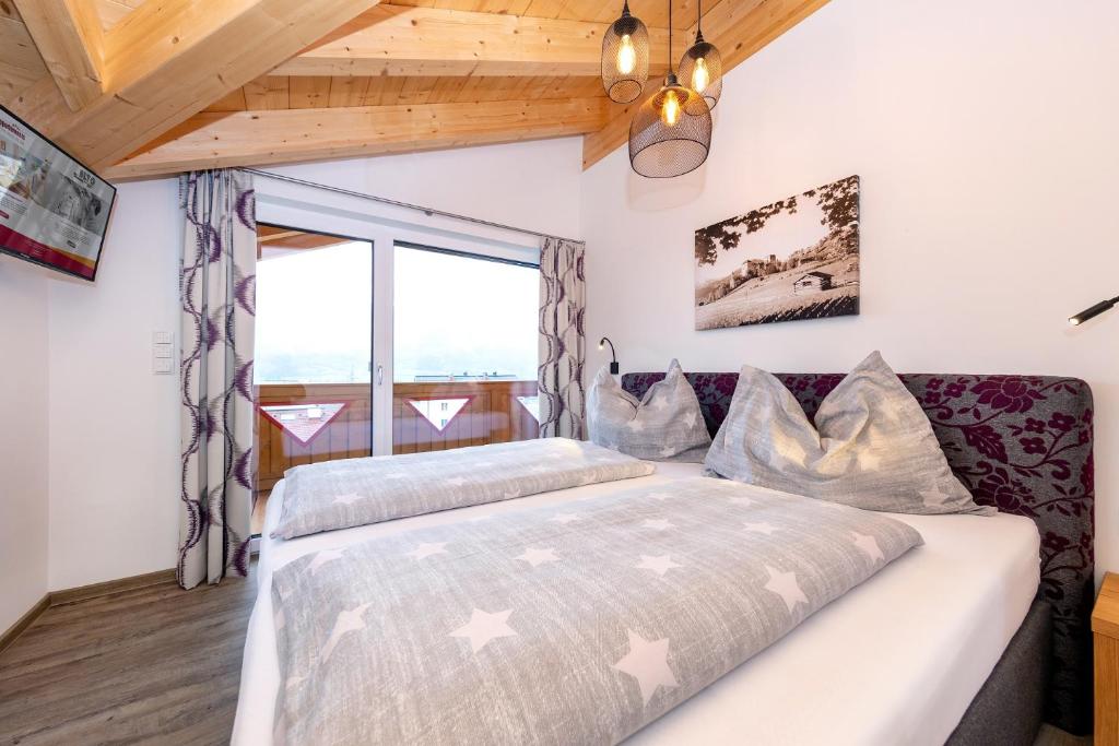 Ένα ή περισσότερα κρεβάτια σε δωμάτιο στο Elto Appartements Chalet
