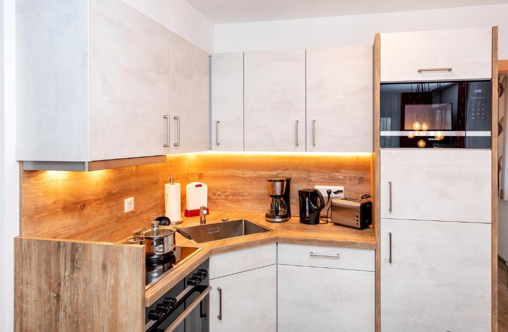 Η κουζίνα ή μικρή κουζίνα στο Elto Appartements Chalet
