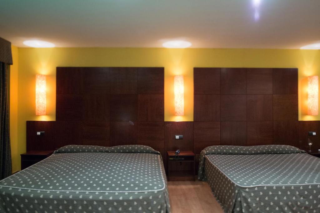 Posteľ alebo postele v izbe v ubytovaní Motel Emporio