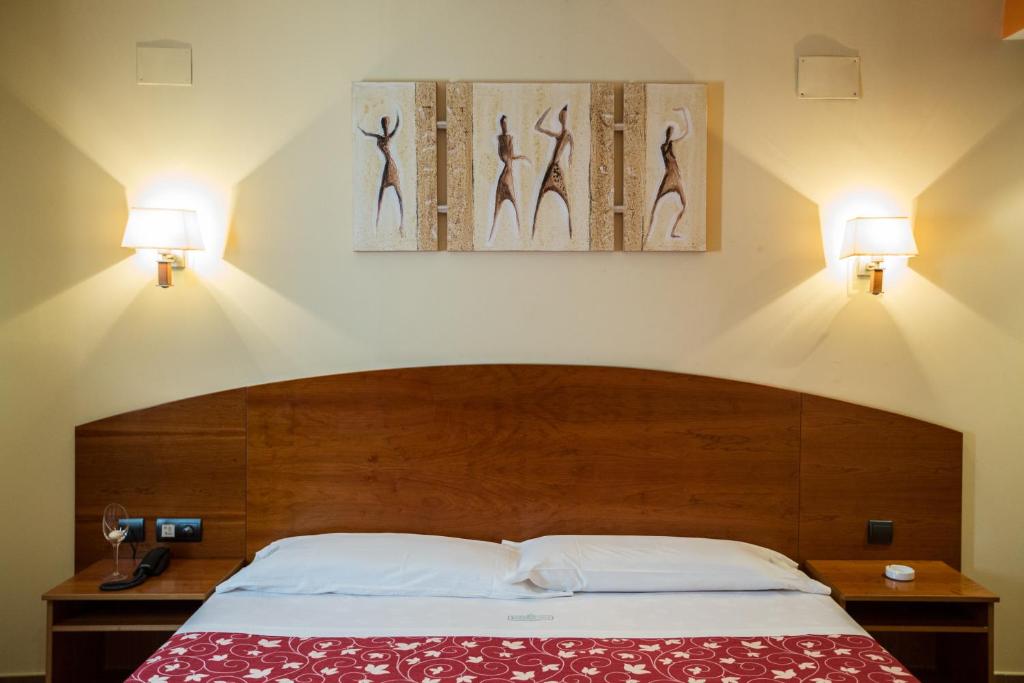 Posteľ alebo postele v izbe v ubytovaní Motel Emporio