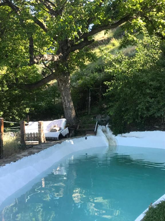 The swimming pool at or close to "Casa Ibero" Bubion, Alojamiento Turistico Rural