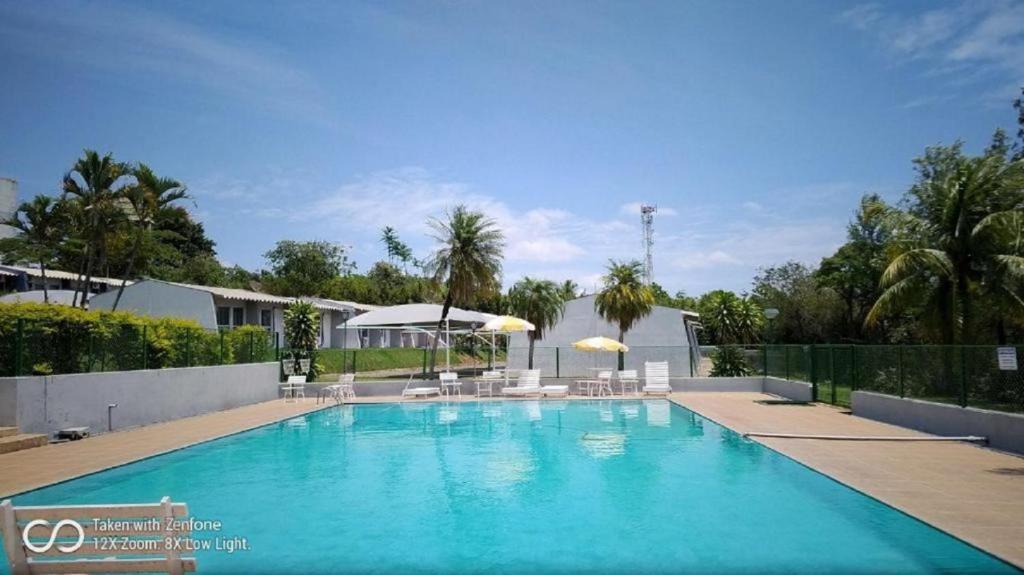 
The swimming pool at or near Gran Tour Hotel de Capivari
