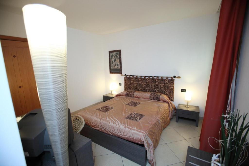 Postel nebo postele na pokoji v ubytování B&B Ca' Loi