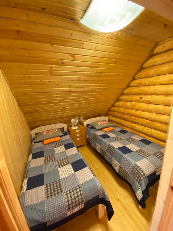 Postel nebo postele na pokoji v ubytování Žubītes