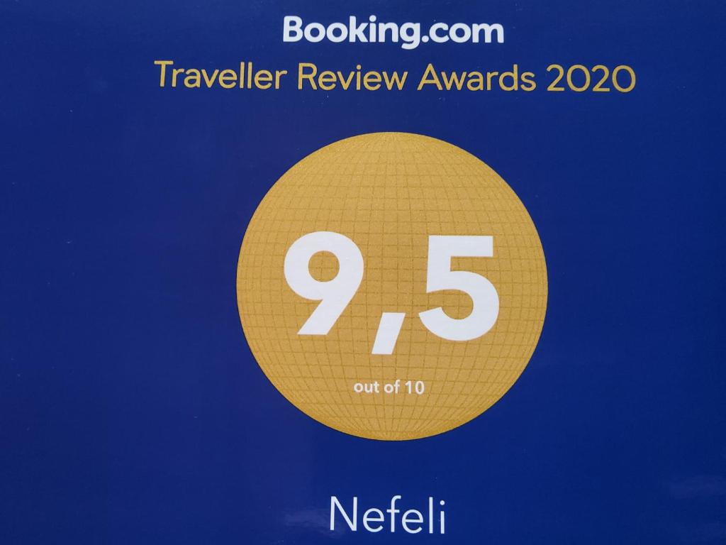 a yellow circle with the number on it at Nefeli in Livadi