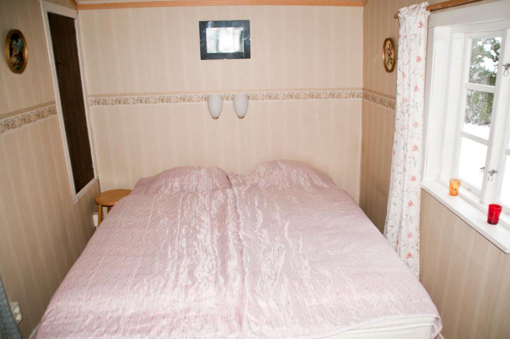 Postel nebo postele na pokoji v ubytování Nickarve Gård Hejdeby
