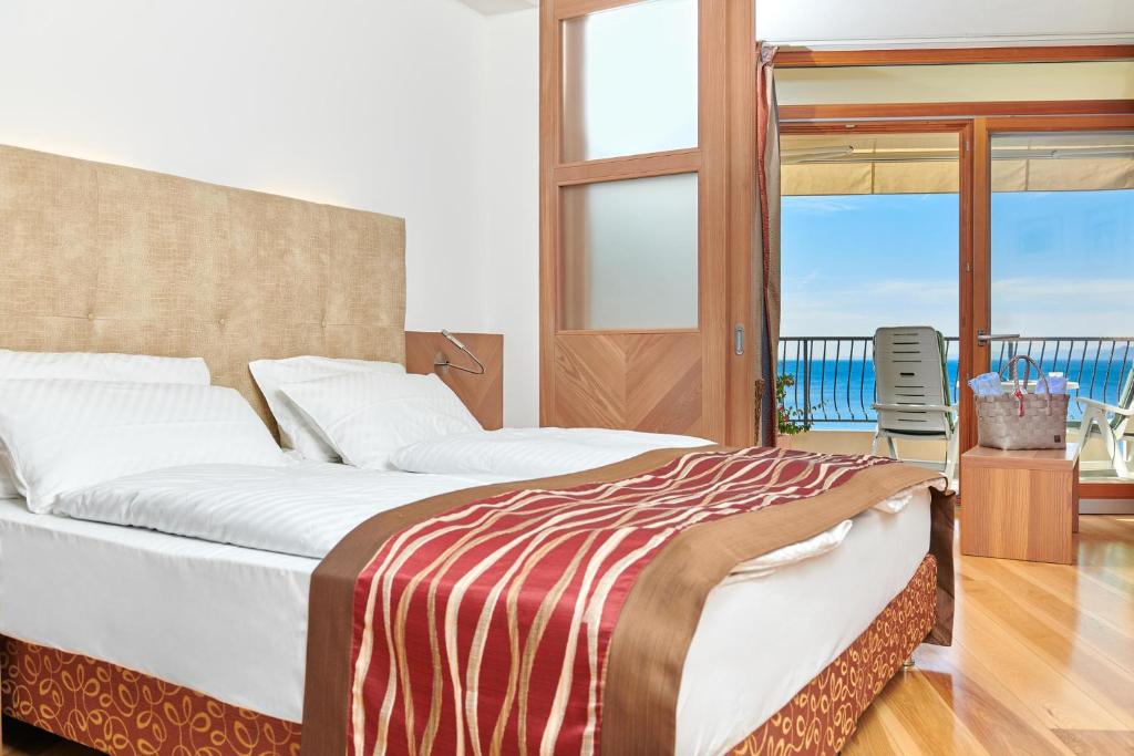 Postel nebo postele na pokoji v ubytování Hotel Baia Verde