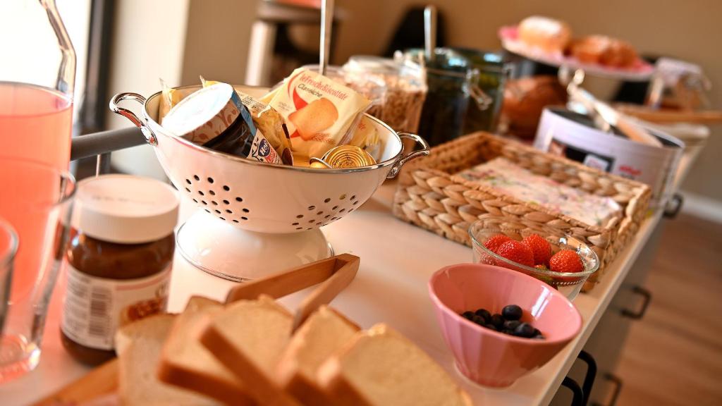 a table with a bunch of food on a counter at L'Iris B&B in Terrazza in Lucca