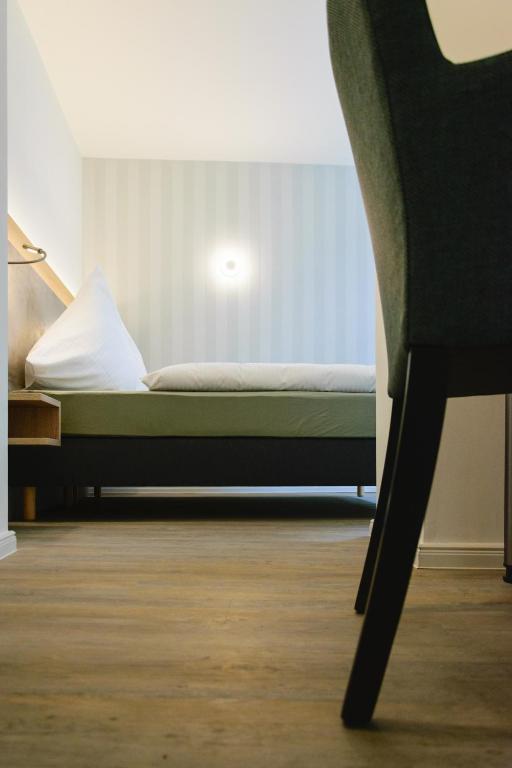 Postel nebo postele na pokoji v ubytování Hotel Zur Alten Börse