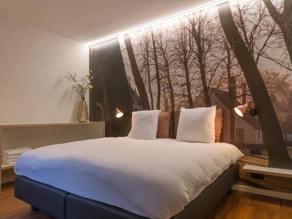 Postel nebo postele na pokoji v ubytování Hotel Marcel