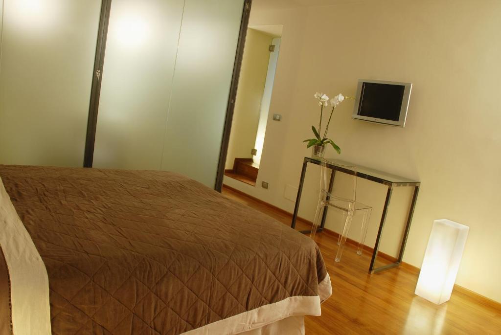 TV a/nebo společenská místnost v ubytování B&B Terres D'Aventure Suites