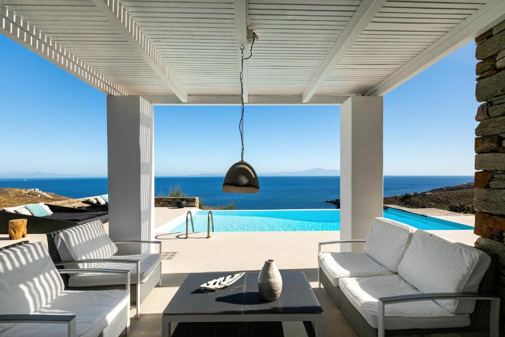 a living room with a view of the ocean at Villa Sandra Maria in Vourkari