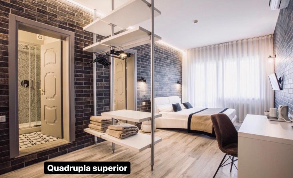 Postel nebo postele na pokoji v ubytování Hotel Ariston