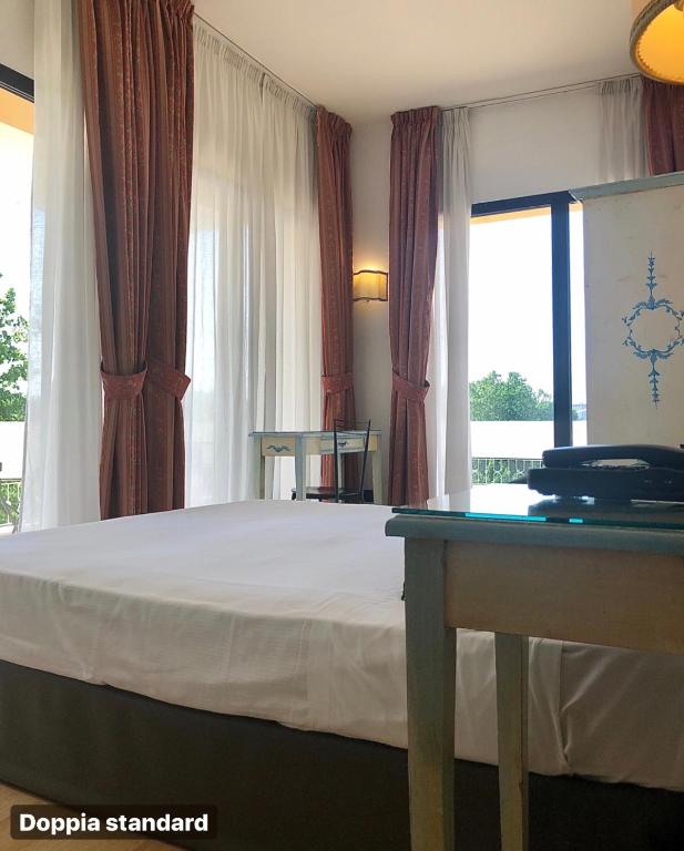 Postel nebo postele na pokoji v ubytování Hotel Ariston