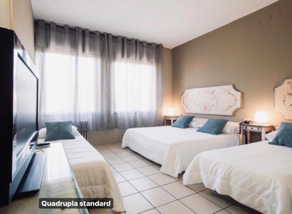 Postel nebo postele na pokoji v ubytování Hotel Ariston