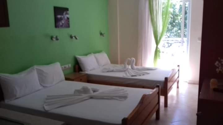 Postel nebo postele na pokoji v ubytování Poseidon rooms