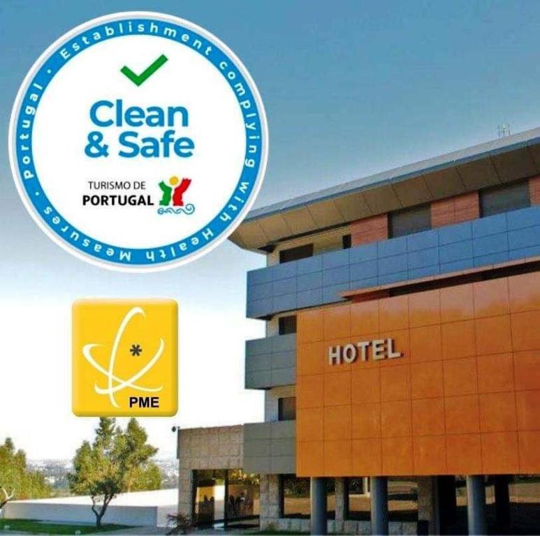 a hotel with a sign that says clean and safe at Paredes Design Hotel in Paredes