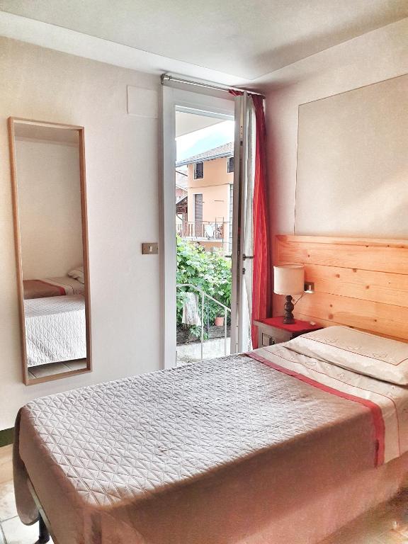 Postel nebo postele na pokoji v ubytování B&B Il Pettirosso