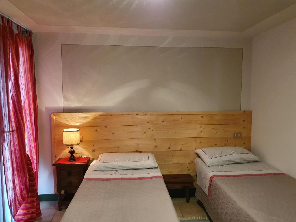 Postel nebo postele na pokoji v ubytování B&B Il Pettirosso