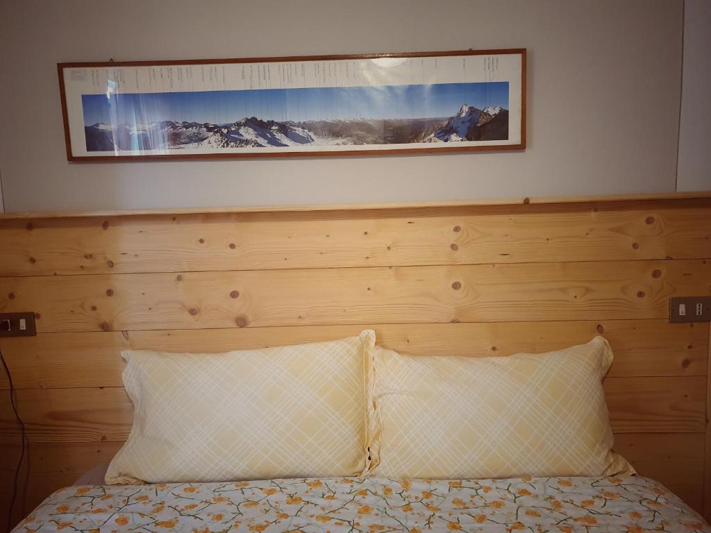 Postel nebo postele na pokoji v ubytování B&B Il Pettirosso