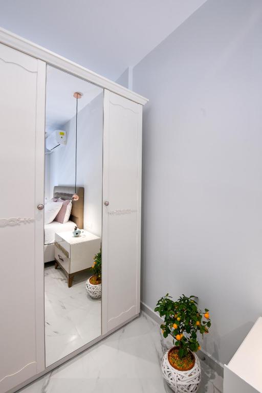 Postel nebo postele na pokoji v ubytování Adell Deluxe Apartments