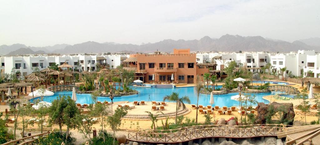 an aerial view of a resort with two pools at DELTA SHARM RESORT ,Official Web, DELTA RENT, Sharm El Sheikh, South Sinai, Egypt in Sharm El Sheikh
