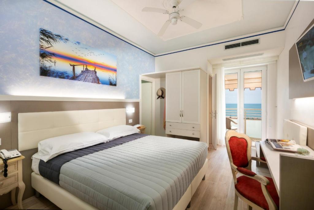 Postel nebo postele na pokoji v ubytování Hotel Danieli