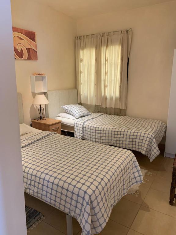 Postel nebo postele na pokoji v ubytování Paraiso